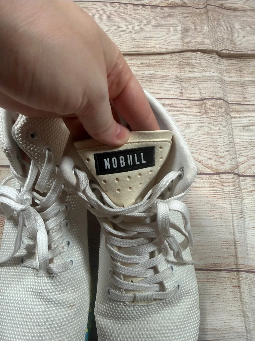 NOBULL‎ white high-top trainers featuring a vibrant multi-color glitch sole
